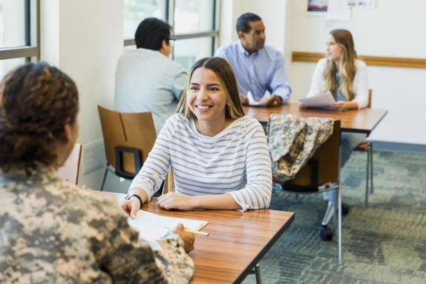 istock Student receiving support from military veteran during meeting 2195720078