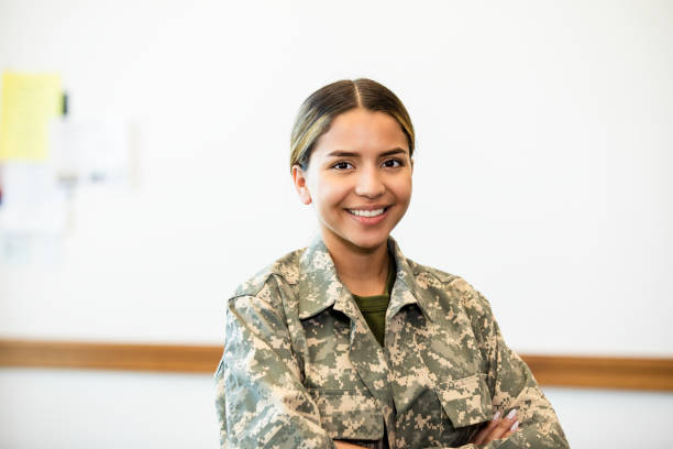 istock Confident Female Soldier Smiling in Military Uniform 2195720266