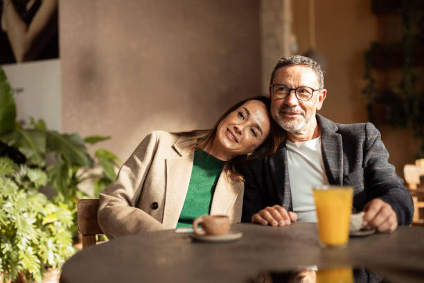 istock Happy couple relaxing with coffee together 2195720644