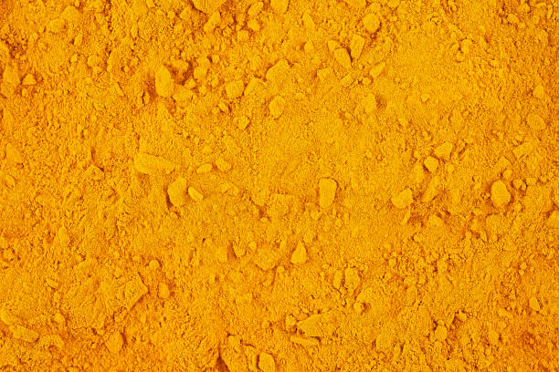 istock Curcuma spice powder as background, top view. Aromatic ground turmeric. Curcuma longa. 2195721406