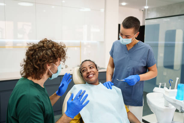 istock Friendly Dental Checkup for Smiling Black Female Patient 2195721436
