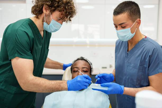 istock Diverse Dentists Preparing Dental Cement for Procedure 2195721452