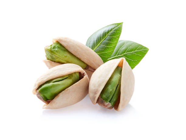 istock Pistachio with leaves in closeup on white background 2195723045
