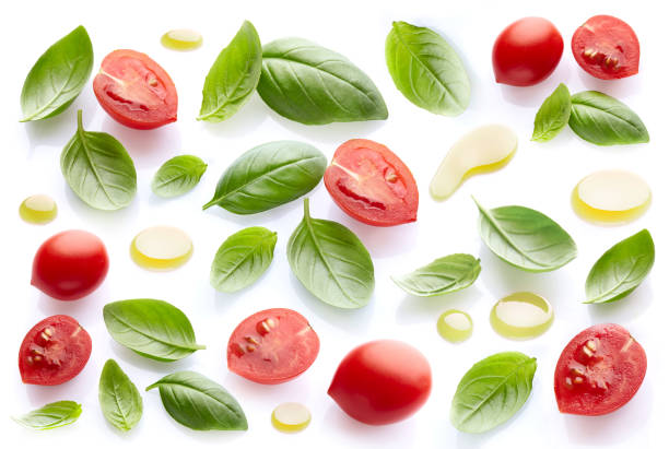 istock Basil leaves with tomatoes and olive oil 2195723047
