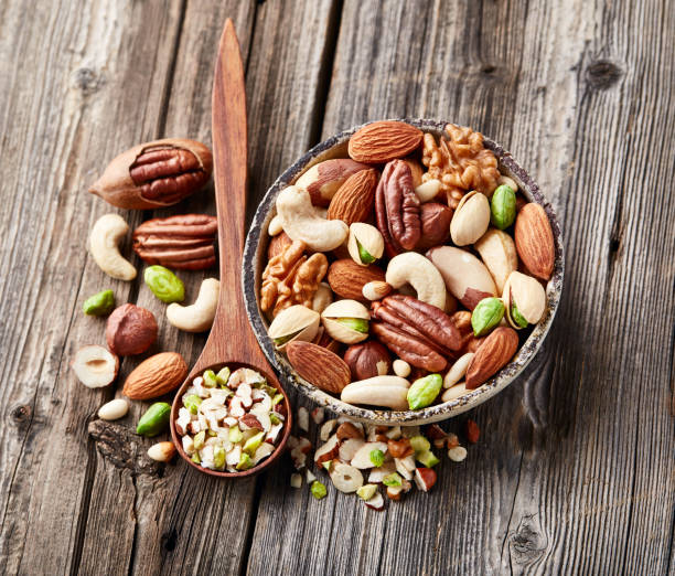 istock Mix nuts on a wooden background. 2195724213