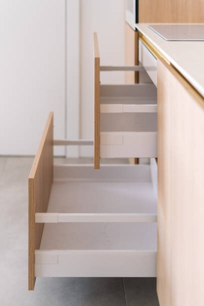 istock Modern kitchen interior showcasing minimalist design with open drawers 2195724654