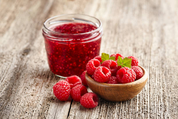 istock Raspberry jam with berry on  wooden background 2195724816