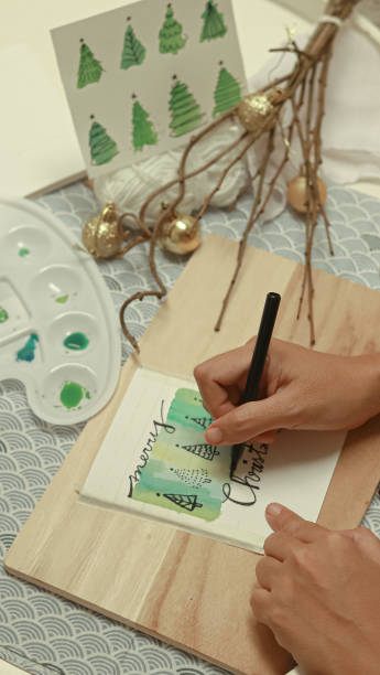 istock Writing Merry Christmas on a hand painted holidays greetings 2195725357