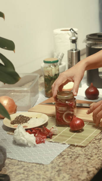 istock Making homemade red onion pickles 2195725710