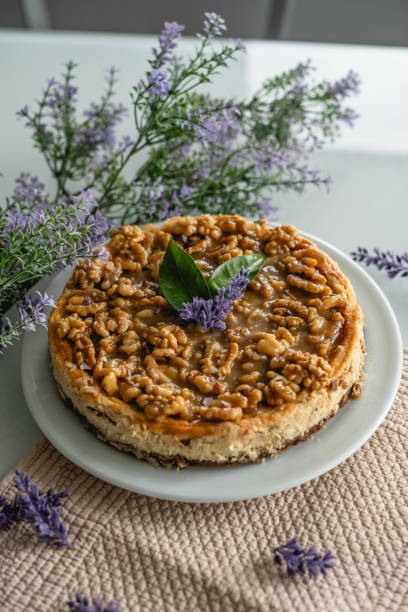 istock homemade cheesecake with nuts. decorated with flowers on a table at home 2195726342