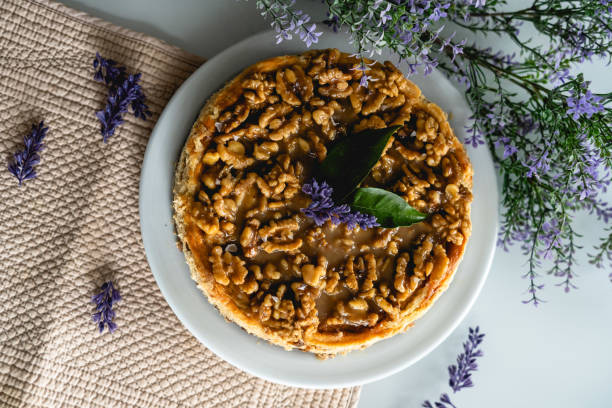 istock homemade cheesecake with nuts. decorated with flowers on a table at home 2195726733
