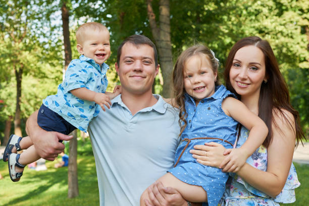 istock family in summer park 2195727992