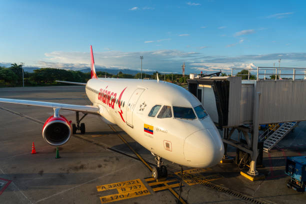 Avianca plane parked in the boarding area at Palmira airport. Colombia Avianca plane in the boarding area of Alfonso Bonilla Aragón International Airport. Valle del Cauca. Colombia. November 24, 2024. palmira colombia stock pictures, royalty-free photos & images