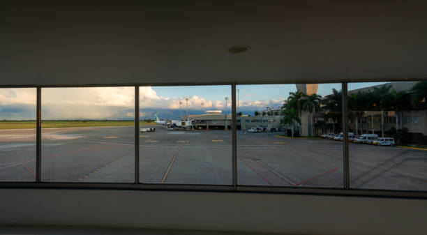 View from inside the Palmira airport of the aircraft parking area. Colombia. View from the windows of one of the boarding areas next to the control tower at Alfonso Bonilla Aragón International Airport. Cauca Valley. Colombia. November 24, 2024. palmira colombia stock pictures, royalty-free photos & images