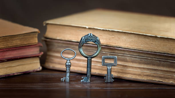 istock Vintage keys and books, escape room game background 2195737704