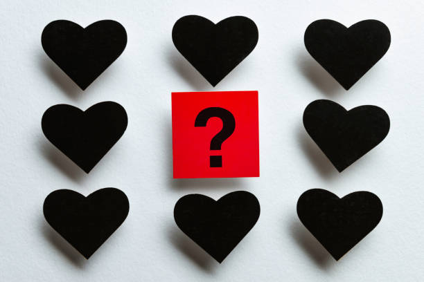 istock Question Mark Among Black Hearts on White Background 2195738307