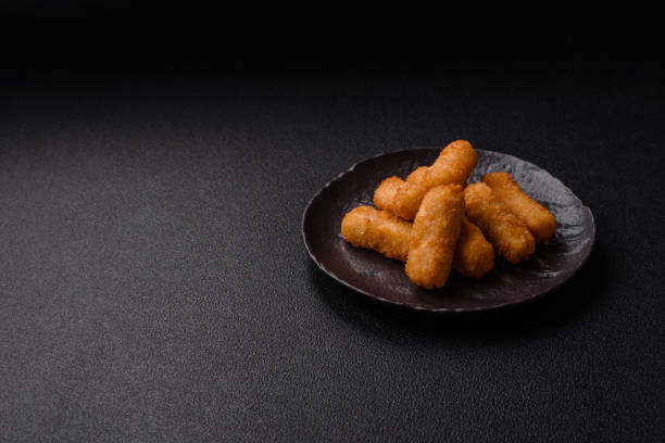 istock Delicious crispy cheese sticks with mozzarella, salt and spices 2195750272