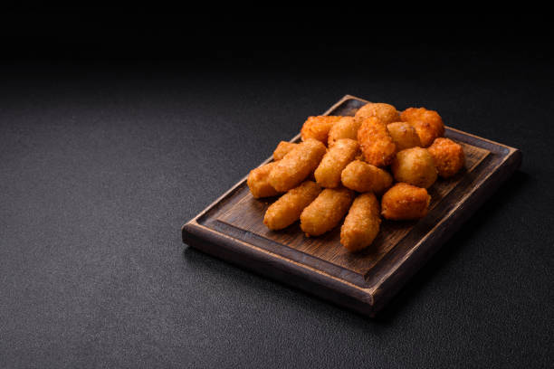 istock Delicious crispy cheese sticks with mozzarella, salt and spices 2195750309