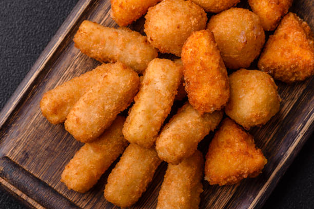 istock Delicious crispy cheese sticks with mozzarella, salt and spices 2195750336