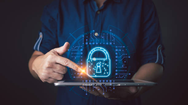 istock A person interacts with a glowing lock icon on a tablet, symbolizing secure cyber data protection, showcasing technology, innovation, and safeguarding sensitive information in the digital age. 2195751585