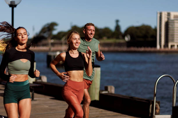 istock Friends jogging together 2195751831