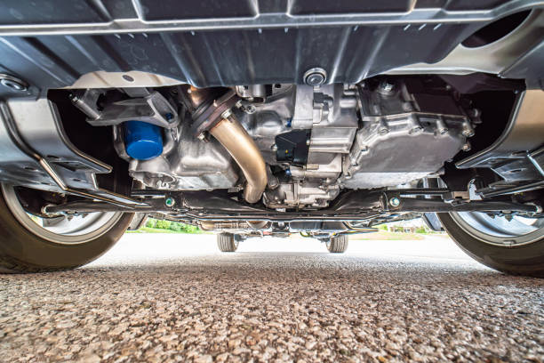 istock Car bottom view, part of catalytic converter in automobile exhaust system. Engine oil filter and pan. Transmission pan. Pre purchase inspection or pre delivery check up. Auto mechanic view. 2195758024