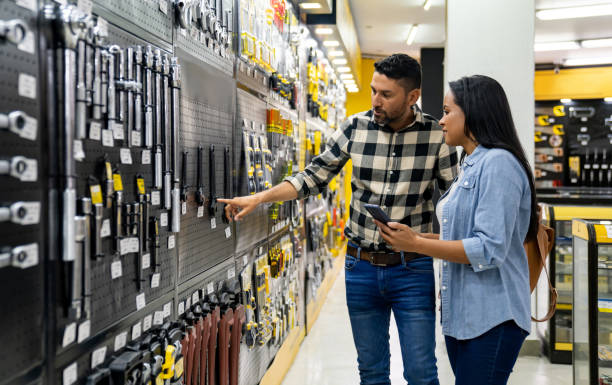 istock Happy couple buying tools at a hardware store 2195758792