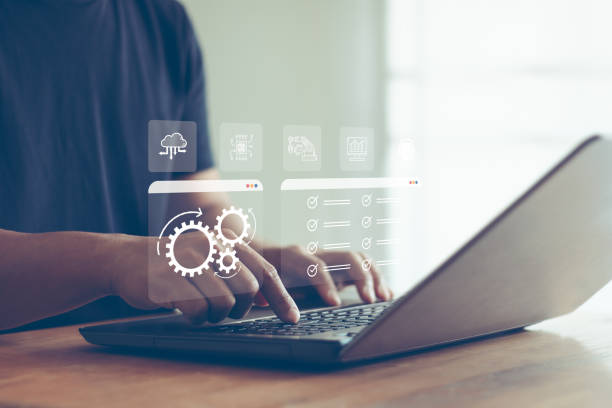 istock Robotic process automation concept, RPA, artificial intelligence. Man use a laptop with virtual automation technology to automate business tasks with AI. Digital transformation and change management. 2195761543