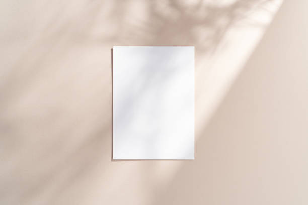 istock Blank vertical 5x7, A4 paper mockup with gobo lighting 2195762256