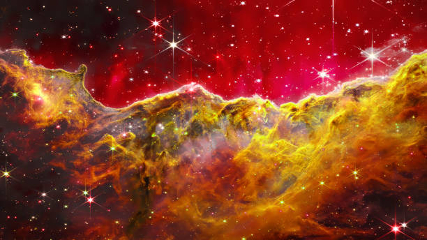 istock Image depicts a nebula with prominent gold and yellow 2195763679