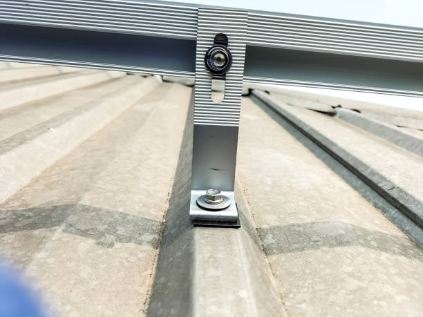 istock Installing a roof mounting kit for installing solar panels. 2195775982