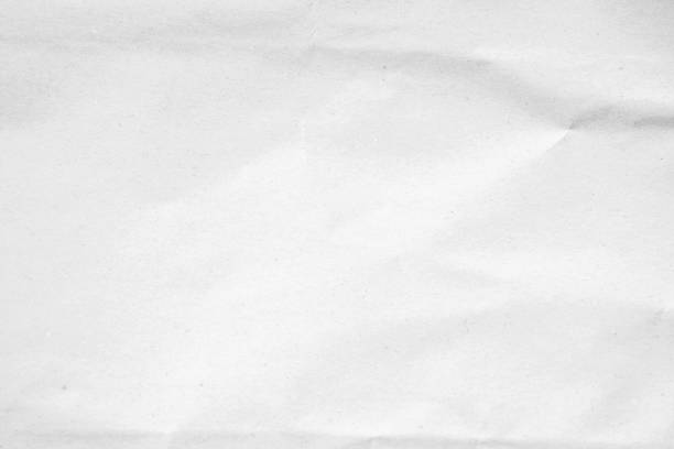 istock White recycled craft paper texture as background. Grey paper texture, Old vintage page or grunge vignette of old newspaper. Pattern rough art creased grunge letter. Hardboard with copy space for text. 2195776697
