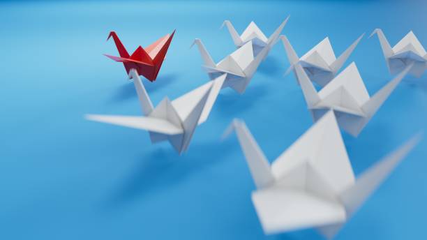 istock Different business concept.new ideas. paper art style. creative idea.leader swan concept using red paper swan among white swans.3D rendering on blue background. 2195777298