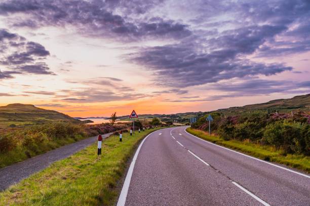 Scenic view of a winding road at sunset in the isle of skye, scotland