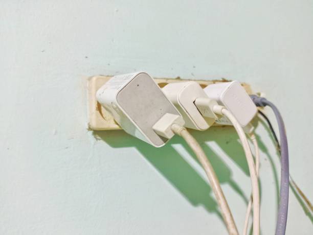 istock Electric socket terminal filled with cellphone charger plugs. 2195793721