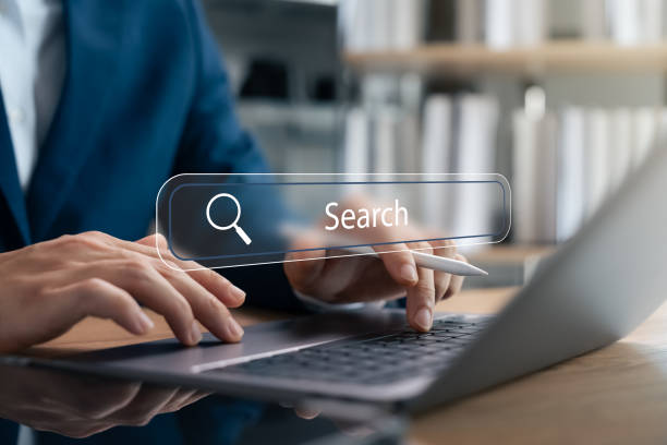 istock SEO Search Engine Optimization, Young Man Using laptop and tablet To Find Insights. 2195796172