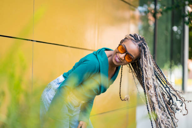 istock Young woman enjoys a sunny day while out for a walk 2195798275