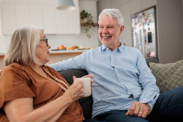 istock Elderly couple chatting at home 2195801836
