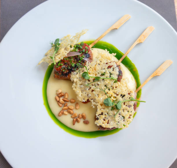 Birds eye view gormet food on clean white plate artistically arranged