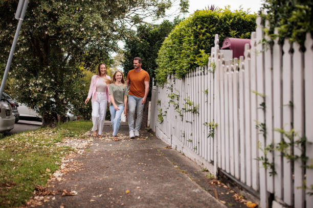 istock Cheerful family enjoying a walk together 2195802933