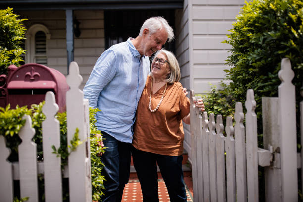 istock Elderly Woman Greets Husband at the Gate 2195803402