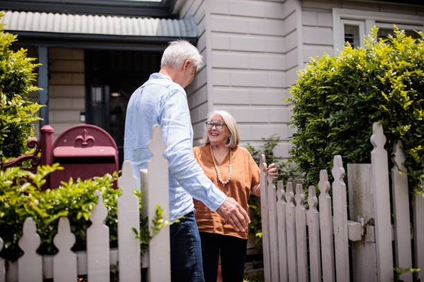 istock Elderly Woman Greets Husband at the Gate 2195803421
