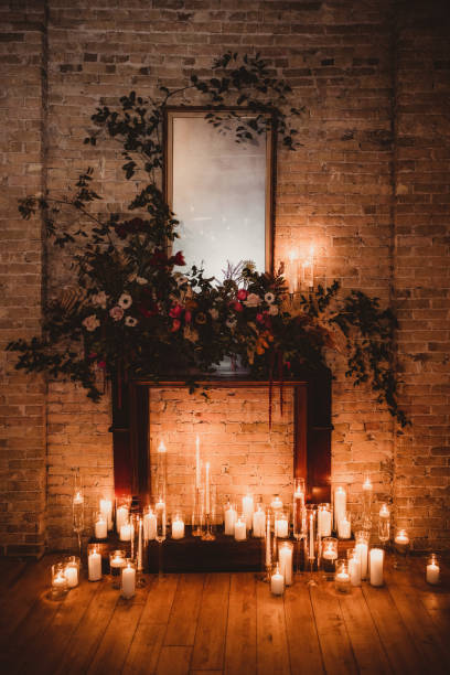 Wedding ceremony alter candlelight fireplace and flowers