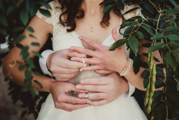 istock Bride and groom exchanging wedding rings at ceremony 2195805857