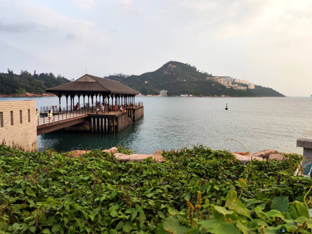 People walking at the historical Blake pier at Stanley village, Hong Kong Island.