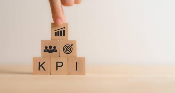 istock KPI concept. Wooden blocks with KPI icons,copy space. Key Performance   Indicator using business intelligence metrics connected to database. Business, finance, operations, sales, marketing performance 2195808062