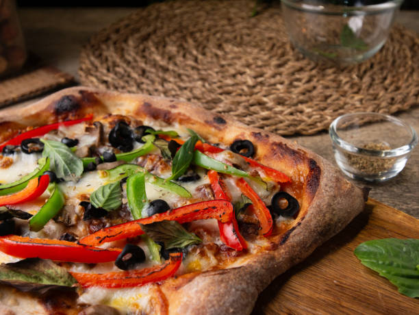 istock Homemade Sourdough pizza on Wooden Table. 2195809123
