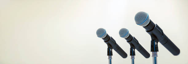 istock Microphone on the stand for public speaking,Welcoming or Congratulations Speech for Work Success background concept. 2195813768