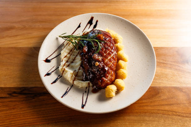 istock Exquisite Plated Crispy Duck Dish with Mashed Potatoes and Artistic Garnish 2195814396