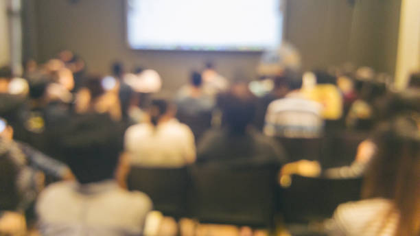 istock Blurred background seminar business event in auditorium hall convention. Blurry Lobby Presentation audience people join meeting at hall conference room business. Blurred background with copy space 2195814590